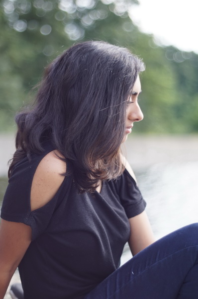 Girl philosophizes by the river.